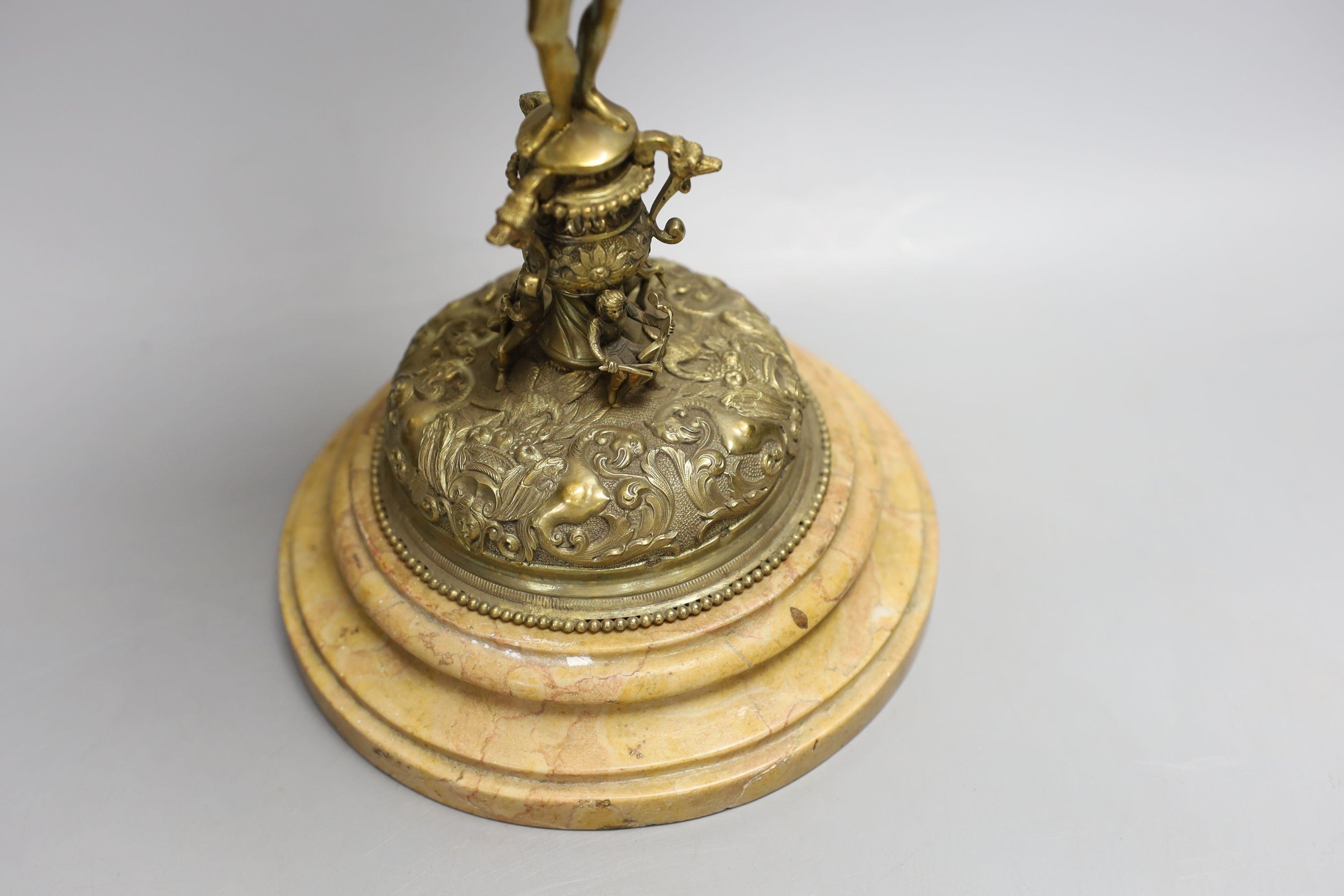 A decorative Bacchus electrotype chalice and cover on stone base - 49cm high